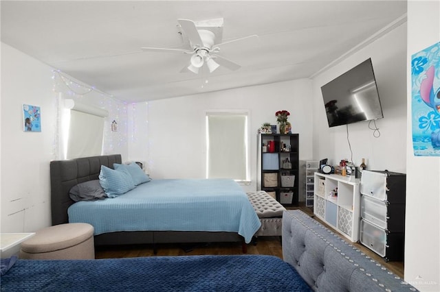 bedroom featuring ceiling fan, dark wood-type flooring, and vaulted ceiling