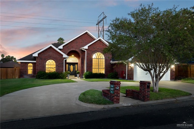 view of front facade featuring a yard and a garage