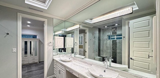 4609 Resaca N St, Harlingen, TX 78552 - bathroom with double vanity, crown molding, and tiled shower