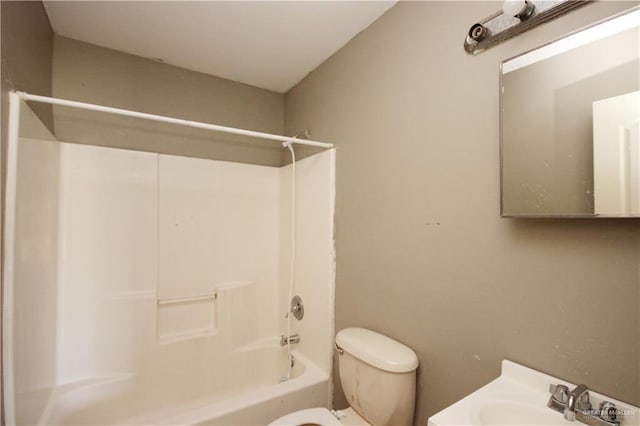 full bathroom featuring toilet, sink, and shower / washtub combination