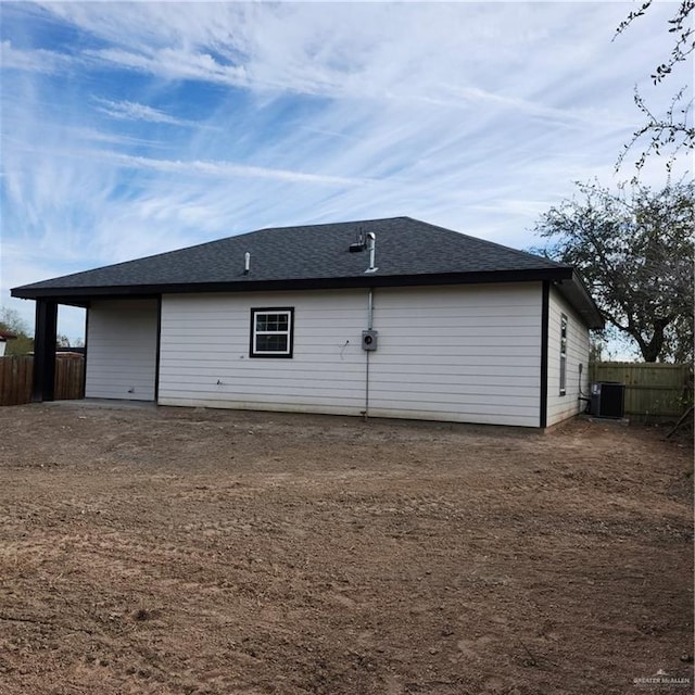 back of house featuring central AC