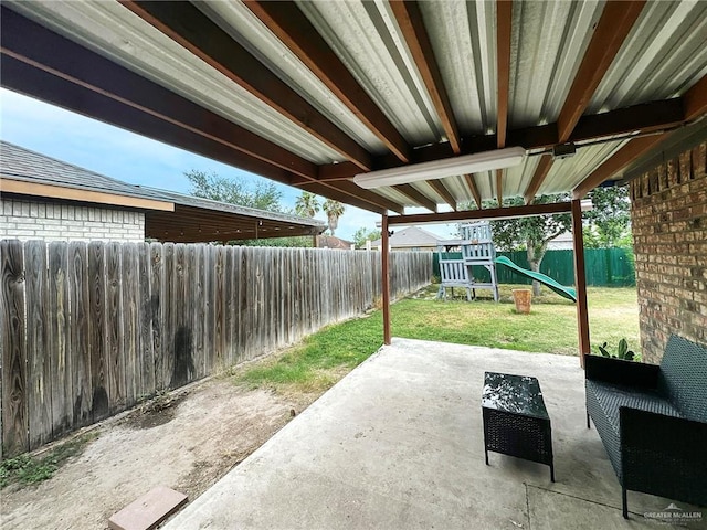 5024 Heron Ave, Mcallen, TX 78504 - fenced backyard featuring a playground and a patio