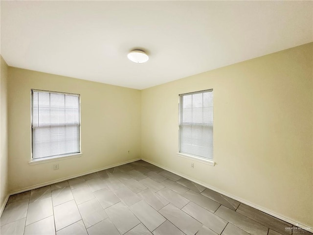 5024 Heron Ave, Mcallen, TX 78504 - unfurnished room featuring plenty of natural light and light tile patterned flooring