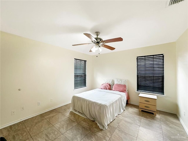 5024 Heron Ave, Mcallen, TX 78504 - bedroom with a ceiling fan and light tile patterned flooring