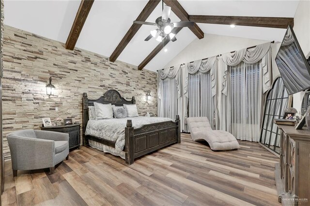 bedroom with light wood-style floors, high vaulted ceiling, ceiling fan, and beam ceiling