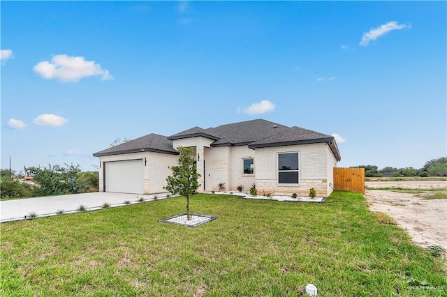 view of front facade featuring a front lawn and a garage