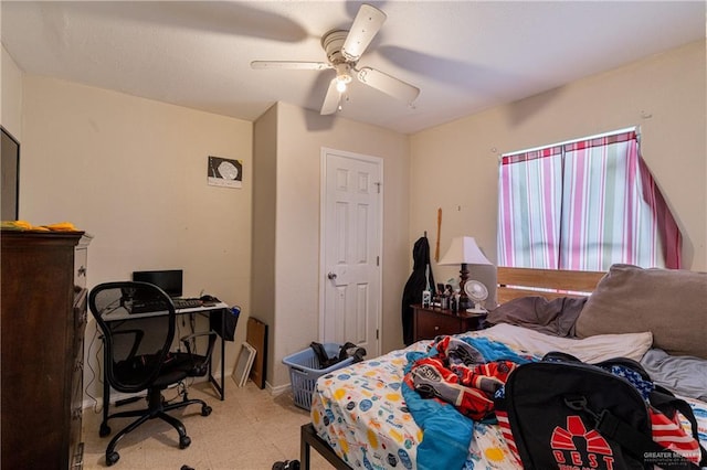 bedroom with light floors and a ceiling fan