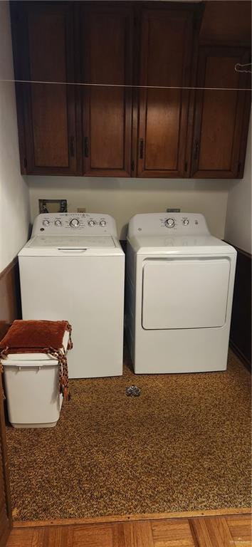 washroom with separate washer and dryer and cabinet space