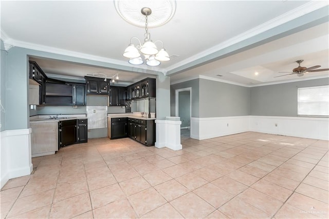 kitchen featuring pendant lighting, ceiling fan with notable chandelier, ornamental molding, and light tile patterned flooring