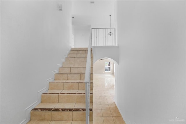 4317 N 5th St, Mcallen, TX 78504 - stairway with arched walkways, tile patterned floors, and a high ceiling