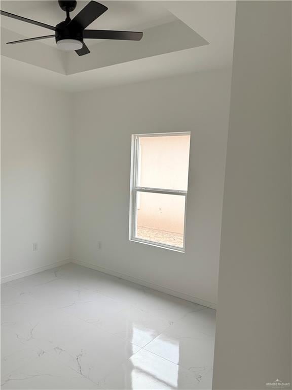 5320 Vision, Rio Grande City, TX 78582 - empty room featuring light marble finish flooring, baseboards, and ceiling fan