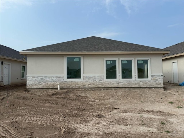 5320 Vision, Rio Grande City, TX 78582 - back of property featuring stone siding, stucco siding, and roof with shingles