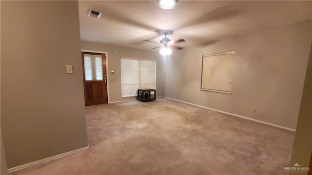 carpeted empty room with ceiling fan