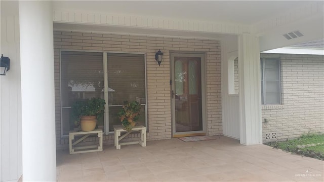 doorway to property with a porch