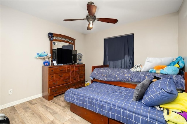 bedroom with ceiling fan and light wood-type flooring