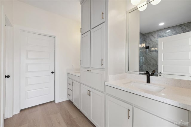 403 Faith Dr, La Feria, TX 78559 - full bath with a walk in shower, wood finished floors, and vanity