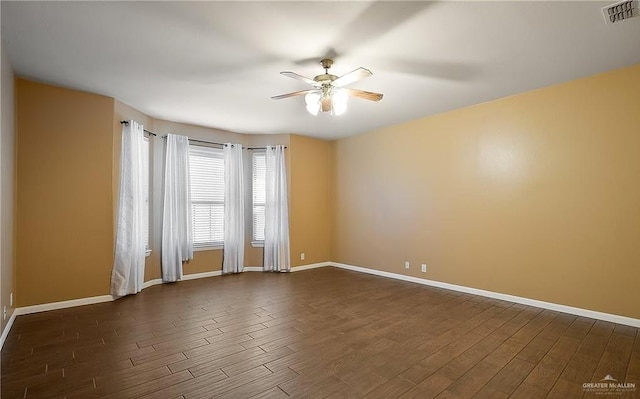 1915 Bunting Ln, Mission, TX 78572 - empty room featuring dark wood finished floors and a ceiling fan