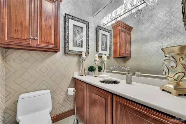 bathroom featuring vanity and toilet