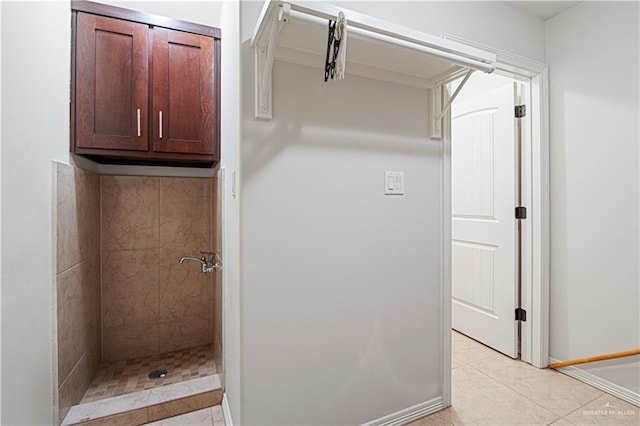 interior space featuring tile patterned floors and a tile shower