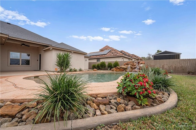 view of pool featuring a patio area and ceiling fan