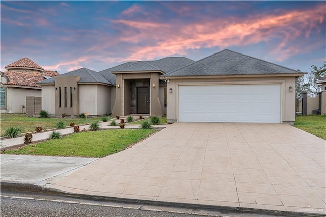 721 Mia Rose Ln, Alamo, TX 78516 - view of front of home featuring a garage and a yard