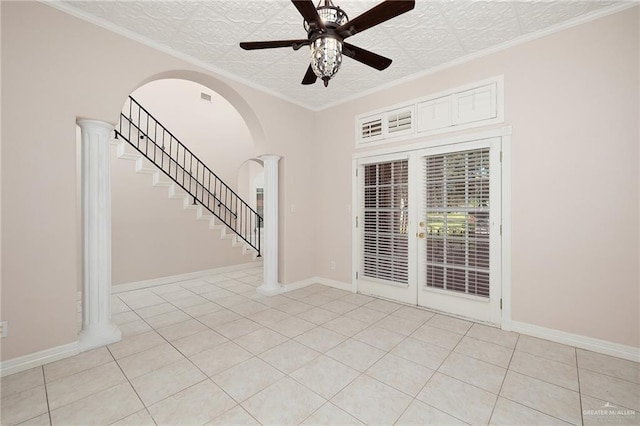 2206 Kings Dr, Edinburg, TX 78539 - empty room featuring ceiling fan, light tile patterned floors, arched walkways, baseboards, and stairs
