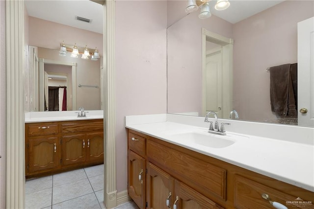 bathroom with tile patterned flooring and vanity