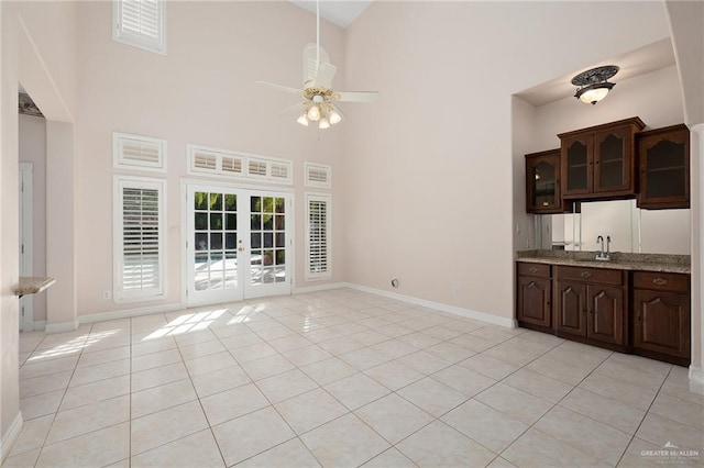 2206 Kings Dr, Edinburg, TX 78539 - kitchen with a high ceiling, a ceiling fan, light tile patterned flooring, french doors, and a sink