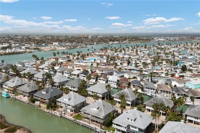 birds eye view of property featuring a water view and a residential view