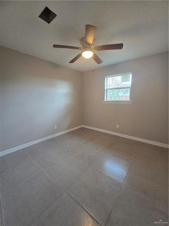 unfurnished room with baseboards, a textured ceiling, and ceiling fan