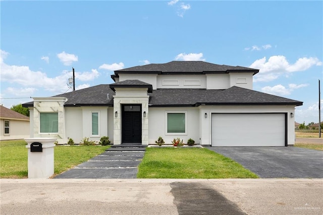 3306 Lauren Dr, Palmview, TX 78574 - prairie-style house featuring driveway, stucco siding, a shingled roof, and a front yard