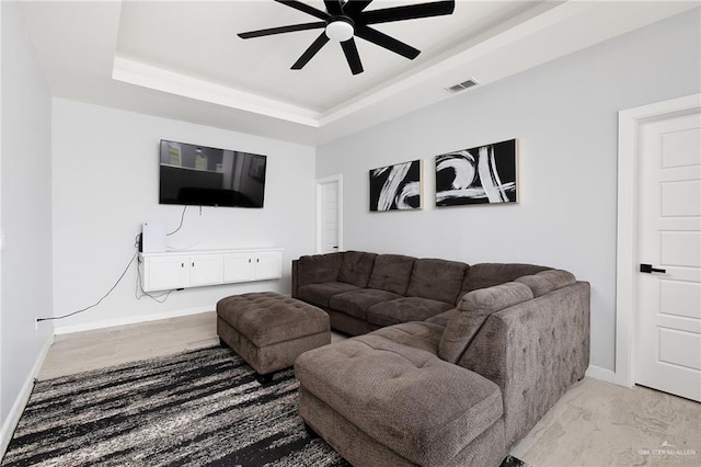 3306 Lauren Dr, Palmview, TX 78574 - living area with ceiling fan, a raised ceiling, baseboards, and visible vents