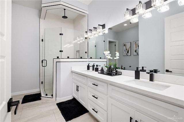 3306 Lauren Dr, Palmview, TX 78574 - full bathroom featuring a sink, double vanity, baseboards, and a shower stall