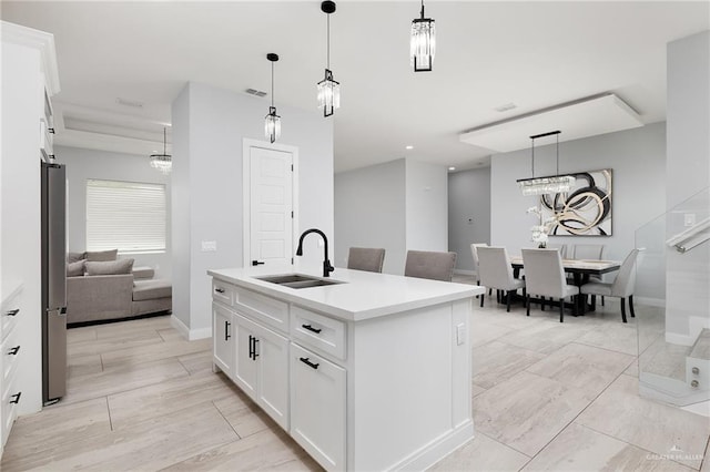 3306 Lauren Dr, Palmview, TX 78574 - kitchen with hanging light fixtures, white cabinets, visible vents, and a sink