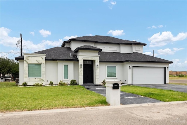 3306 Lauren Dr, Palmview, TX 78574 - prairie-style house with a front yard, aphalt driveway, a shingled roof, and an attached garage