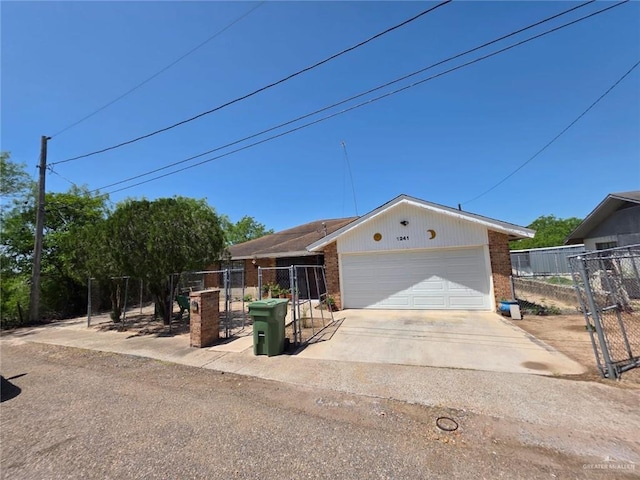 ranch-style home with a garage, brick siding, and fence