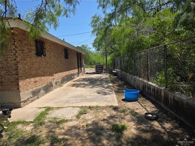 view of yard featuring a patio and fence