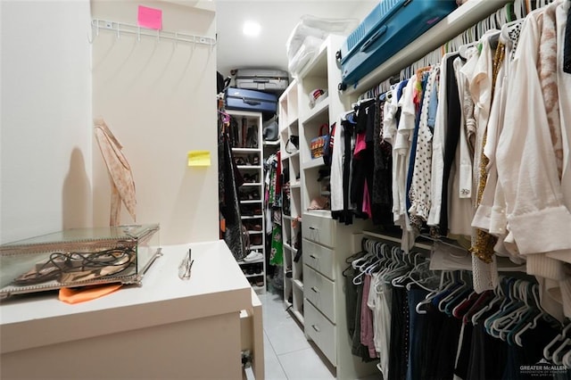 walk in closet with tile patterned flooring