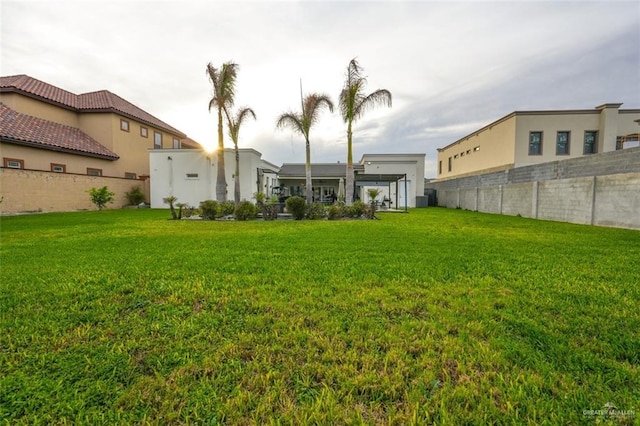 view of yard with fence and central air condition unit