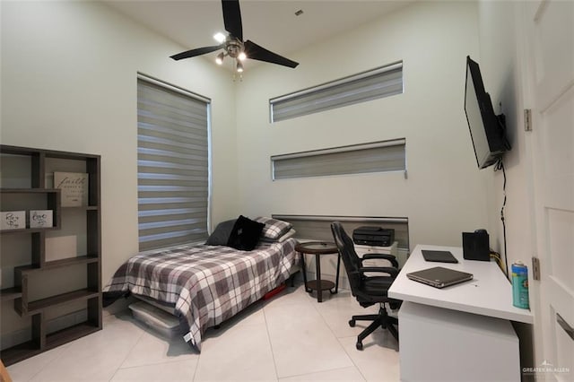 bedroom featuring light tile patterned floors and a ceiling fan