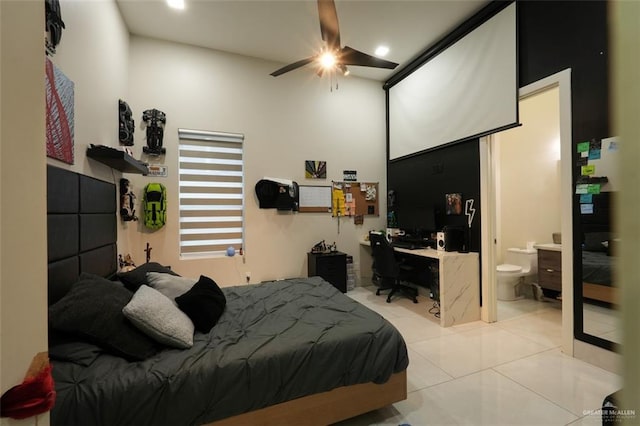 bedroom with ensuite bathroom, ceiling fan, and tile patterned flooring