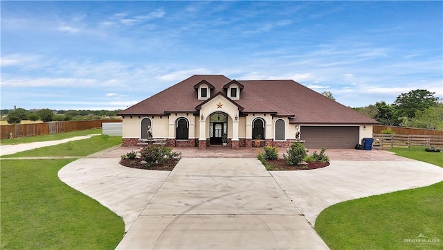 22613 N Sunflower Rd, Monte Alto, TX 78538 - french provincial home featuring stucco siding, driveway, and a garage