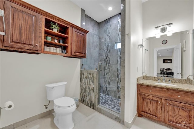 22613 N Sunflower Rd, Monte Alto, TX 78538 - full bathroom with toilet, a shower stall, vanity, and baseboards
