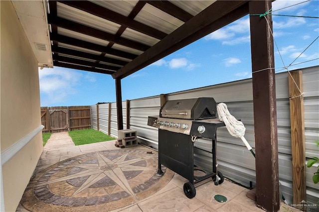 22613 N Sunflower Rd, Monte Alto, TX 78538 - fenced backyard with a patio and a grill