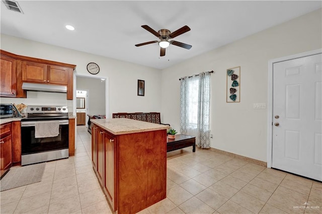 22613 N Sunflower Rd, Monte Alto, TX 78538 - kitchen with appliances with stainless steel finishes, under cabinet range hood, a ceiling fan, light tile patterned floors, and recessed lighting