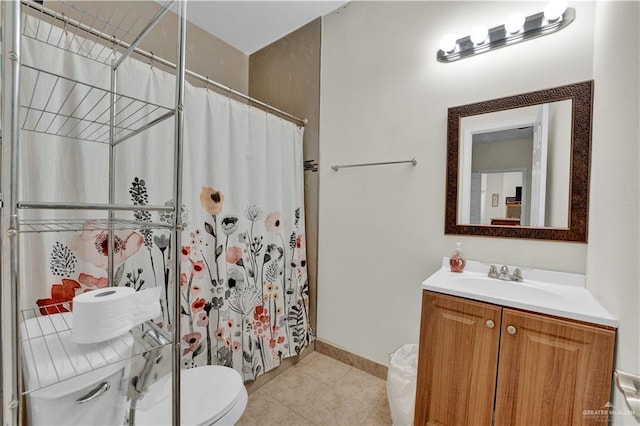 22613 N Sunflower Rd, Monte Alto, TX 78538 - full bath featuring toilet, vanity, tile patterned floors, curtained shower, and baseboards