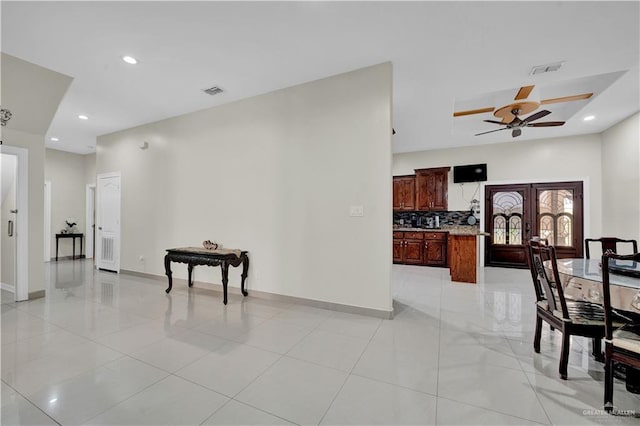 22613 N Sunflower Rd, Monte Alto, TX 78538 - living room featuring ceiling fan, recessed lighting, baseboards, light tile patterned flooring, and french doors