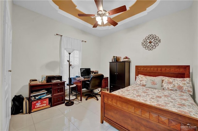 22613 N Sunflower Rd, Monte Alto, TX 78538 - bedroom featuring a raised ceiling, an office area, light tile patterned flooring, and ceiling fan
