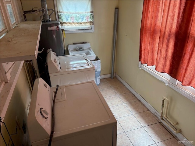 washroom with light tile patterned flooring and washer / dryer