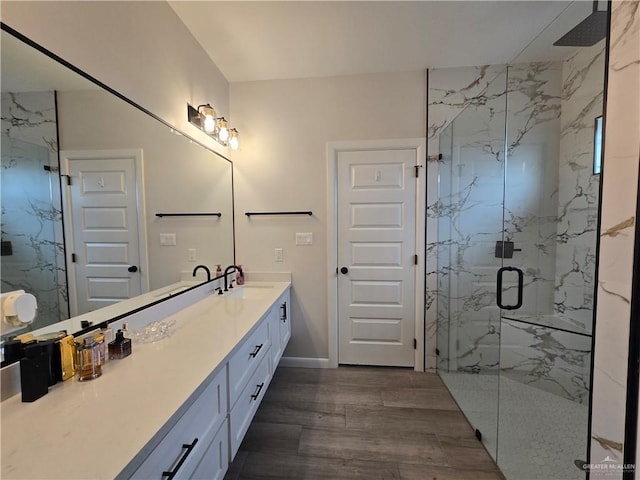 7313 N 25th Ln, Mcallen, TX 78504 - full bathroom featuring a marble finish shower, baseboards, vanity, and wood finished floors